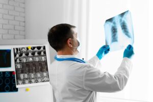 Radiologic Technologist examining lungs X-Ray scan.